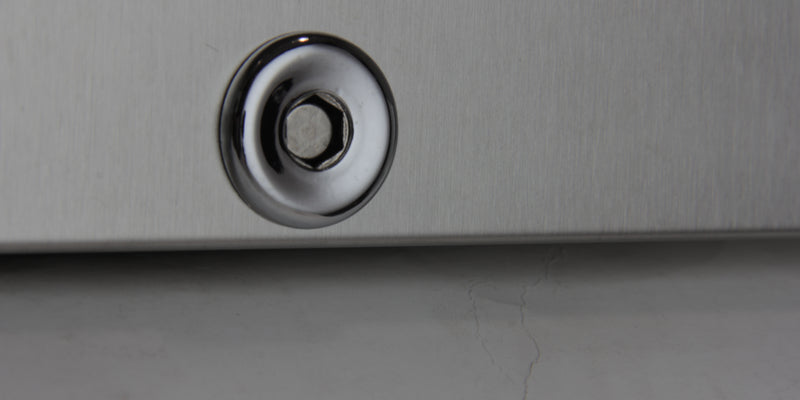 A hex key lock on a wine cooler door