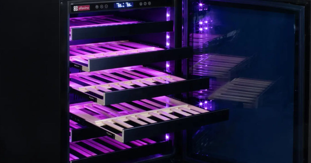 Vibrant violet light emanates from the open door of a wine cooler