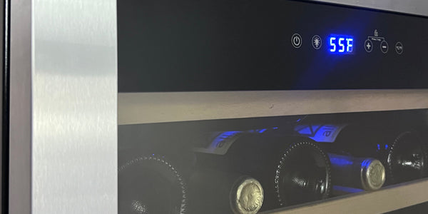 A stainless steel wine fridge with temperature zone controls