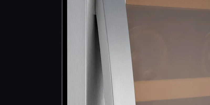A curved steel handle and glass door, both free of smudges and fingerprints