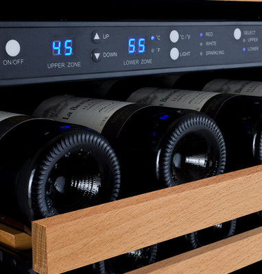 A row of wine bottles beneath their digital thermostat controls
