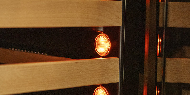 warm orange lighting inside of an Allavino wine fridge